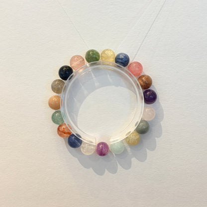 Handmade multicolor crystal bracelet with assorted natural gemstone beads arranged in a circular design